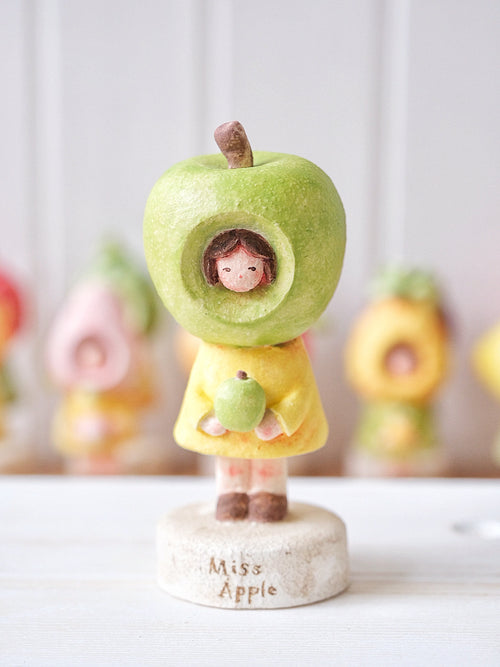 Ms. Apple in Green
