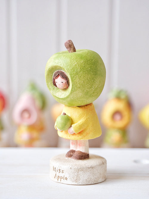Ms. Apple in Green