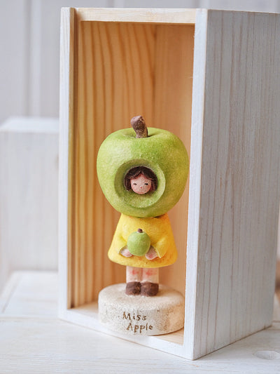 Ms. Apple in Green